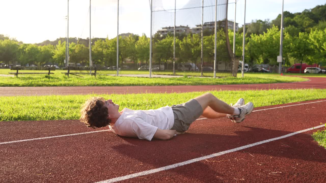Man exercising on running track