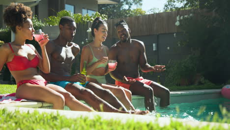 relaxing by pool, diverse friends sharing drinks and sunshine, having joyful moments together