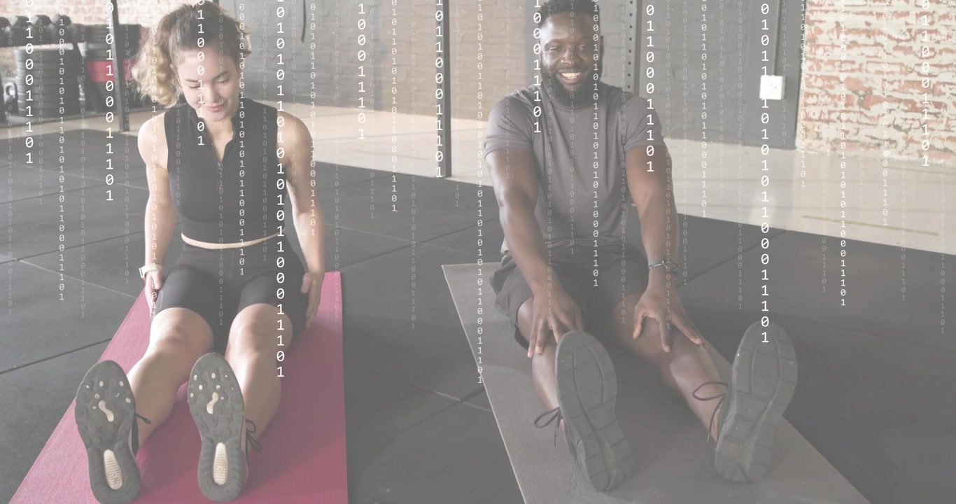 Opening shot showing duo initiating stretch on pink and gray mats in fitness gym, rolling upright