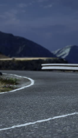 a winding road through a mountain range