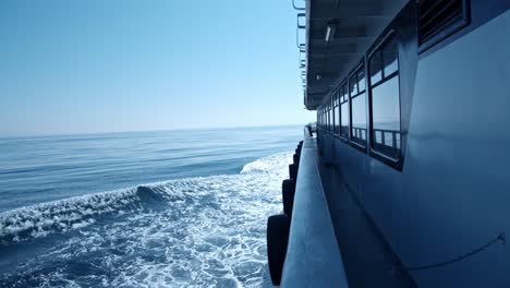 on-the-side-of-a-boat,-looking-toward-the-horizon