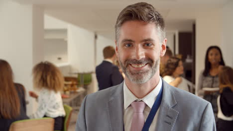 portrait of male delegate during break at conference