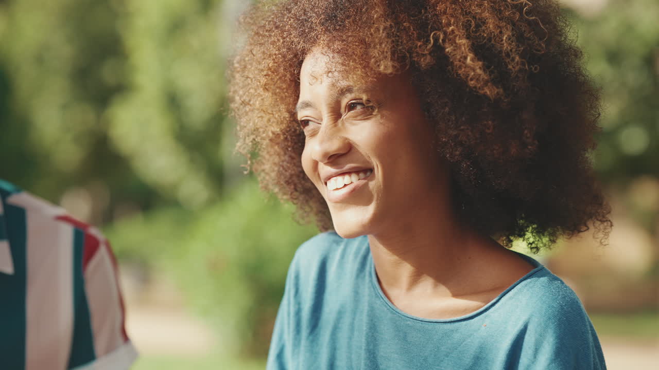 Portrait of a smiling woman with curly hair