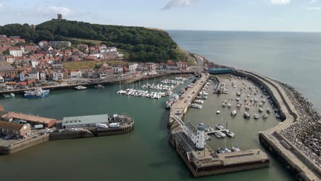 Aerial-bird's-eye-view-of-Scarborough-town,-beach,-harbour-and-castle