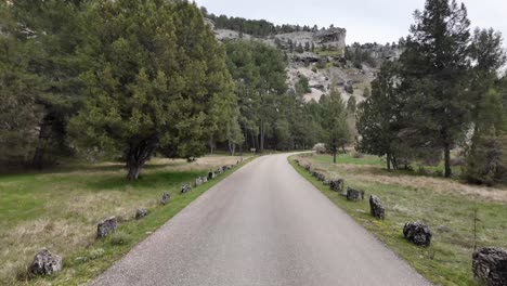 Driver-POV-while-driving-along-a-narrow-mountain-road-in-Soria,-Spain,-Rio-Lobos-Canyon