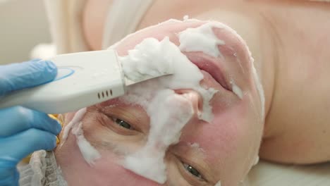 professional ultrasound facial cleansing procedure. hardware cosmetology