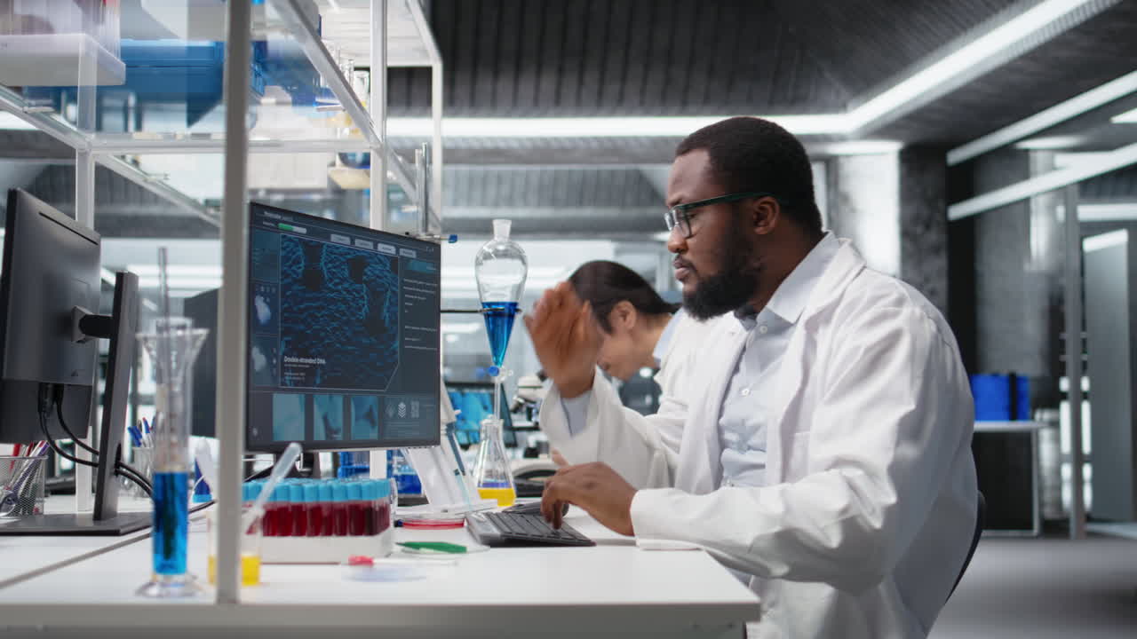 Vertical video Molecular biologist uses computer displaying DNA data, removing eyeglasses