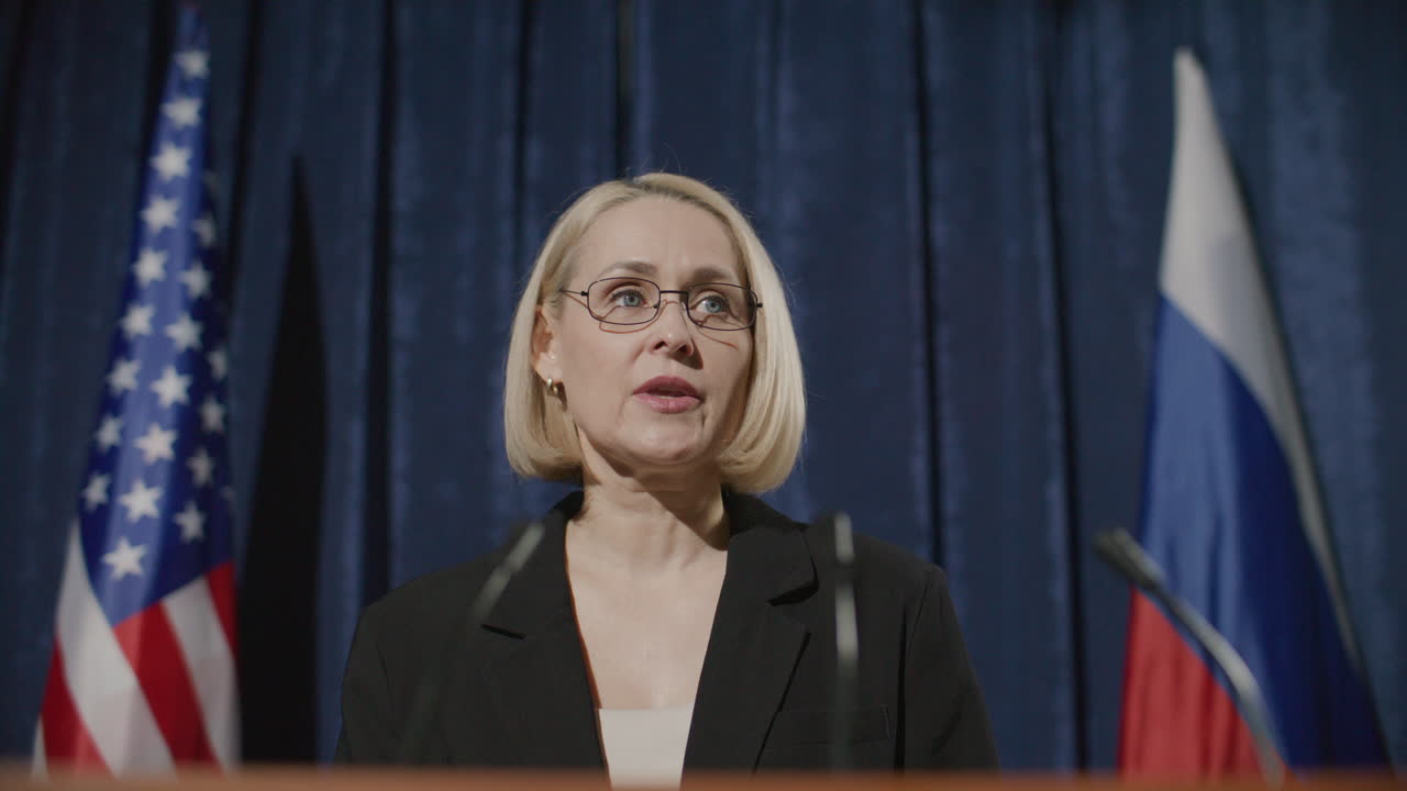 Female Political Leader Speaking at Diplomatic Press Event