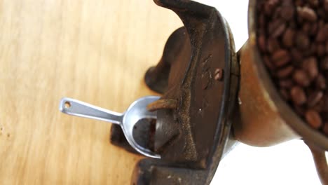 vintage coffee grinder with coffee beans