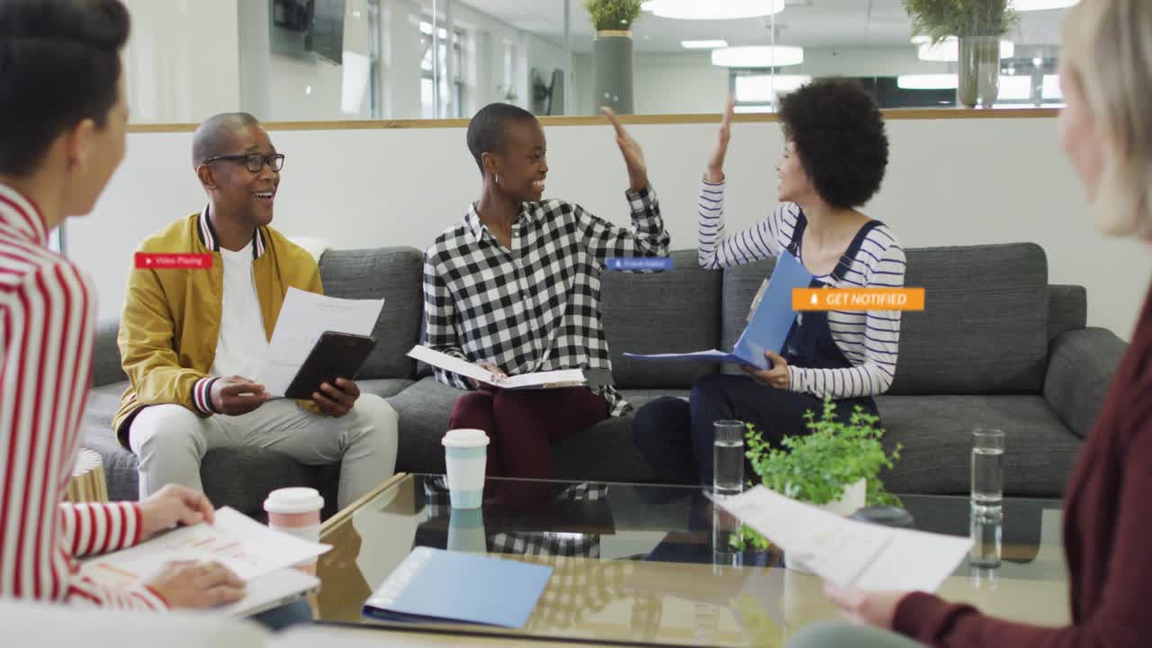 Three colleagues flipping binder pages causing UI badges popping over tablet during business review