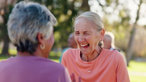 senior women laughing together in the park