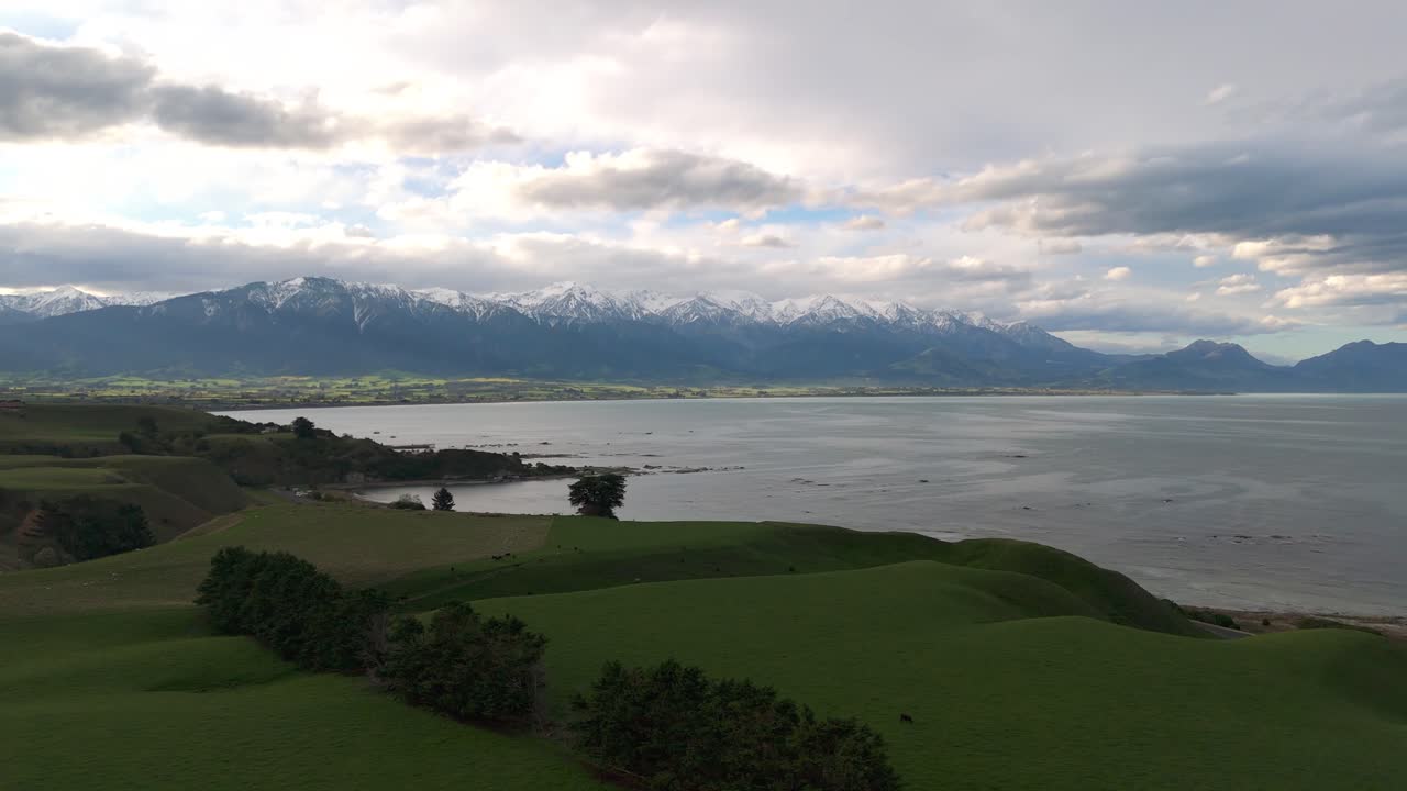 Snow-capped Southern Alps towering above the coastal town of Kaikoura, NZ