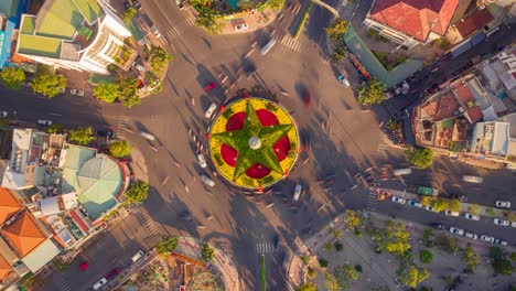 drone hyper lapse of roundabout with traffic moving around in nha trang city, vietnam