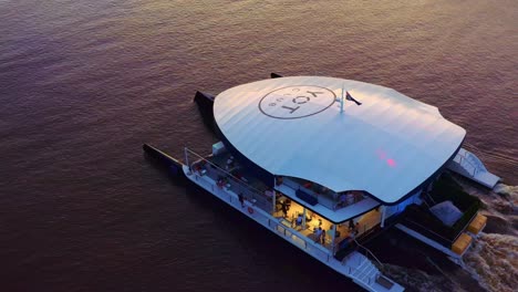 yot club cruising on a sunset - entertainment venue in a super yacht - marina mirage, queensland - aerial drone
