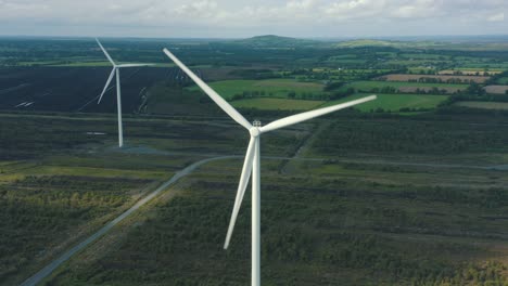 cinematic aerial view of wind turbines energy production- 4k aerial shot