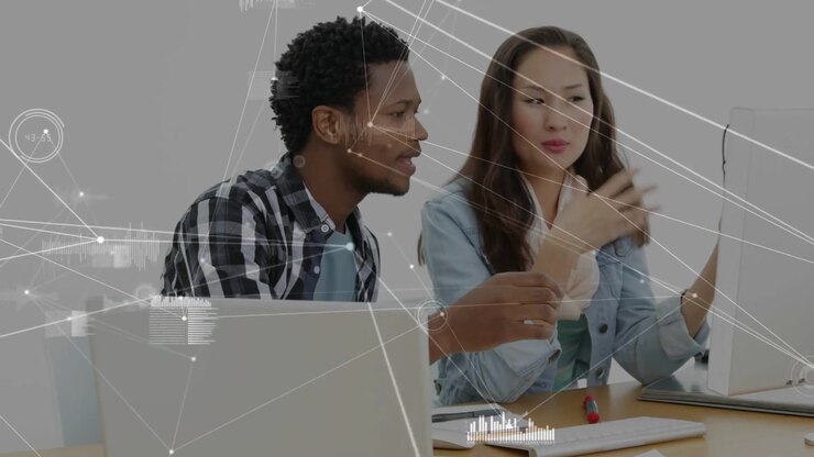 Vertical video: Man leaning, pointing, starting tech test; woman rotating frames, HUD aiding choice