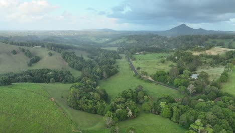 Stationary-drone-Timelapse-of-hills-near-Cooroy-Noosa,-while-it-rains-lightly