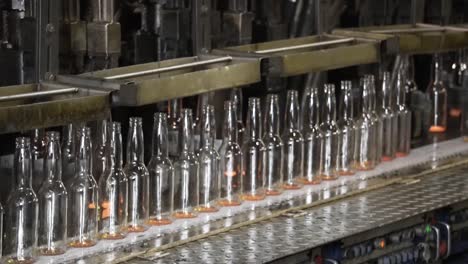 Automatic-conveyor-bottle-production-machine-in-a-glass-factory