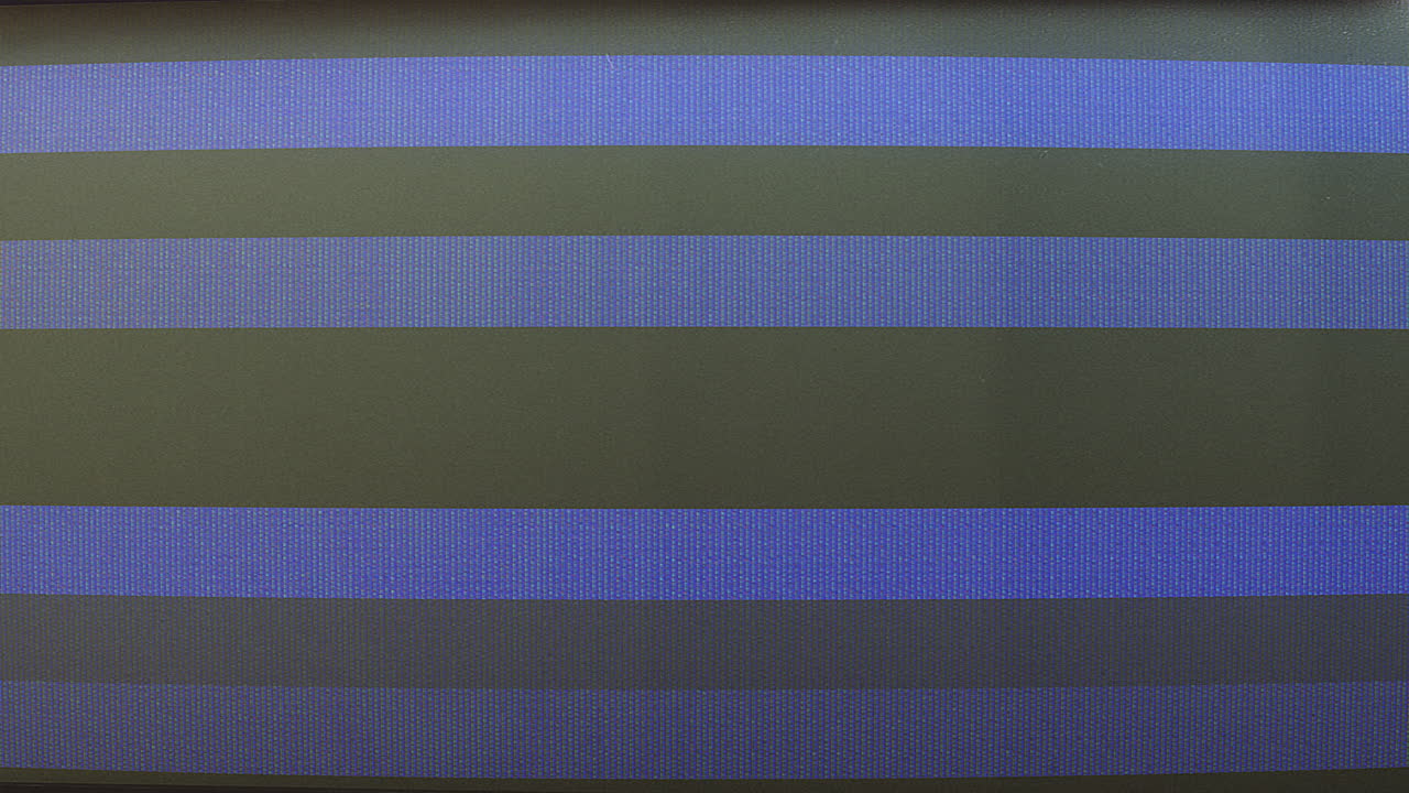 Close-up of Digital Screen with Flickering Static and Pixels