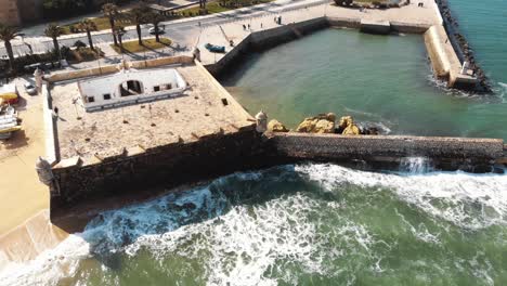 4k aerial drone footage of a tide pool off the boardwalk of lagos, portugal