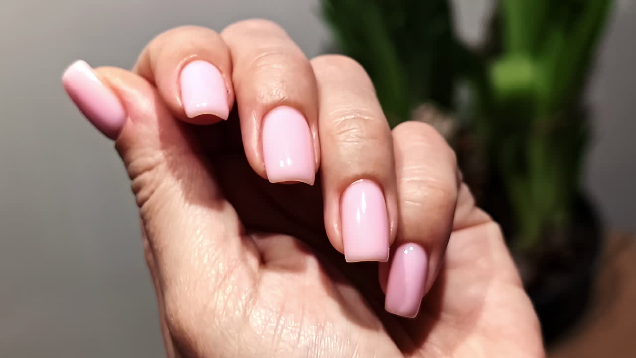 Manicure woman hands opaque matte finish nails polish paint up-close