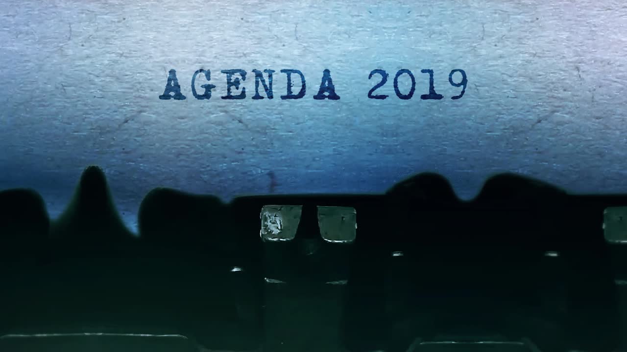 Agenda 2019 word closeup being typing and centered on a sheet of paper on old vintage typewriter