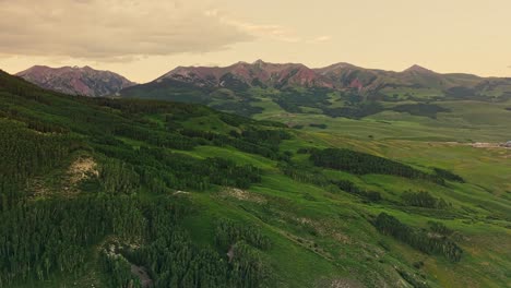 aerial of the rocky mountains under a moody sky as seen from crested butte near boulder, colorado, usa