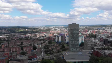 the university of sheffield the arts tower from weston park with city of sheffield in the background sunny summer day rising shot with arts tower framed right 4k 30fps