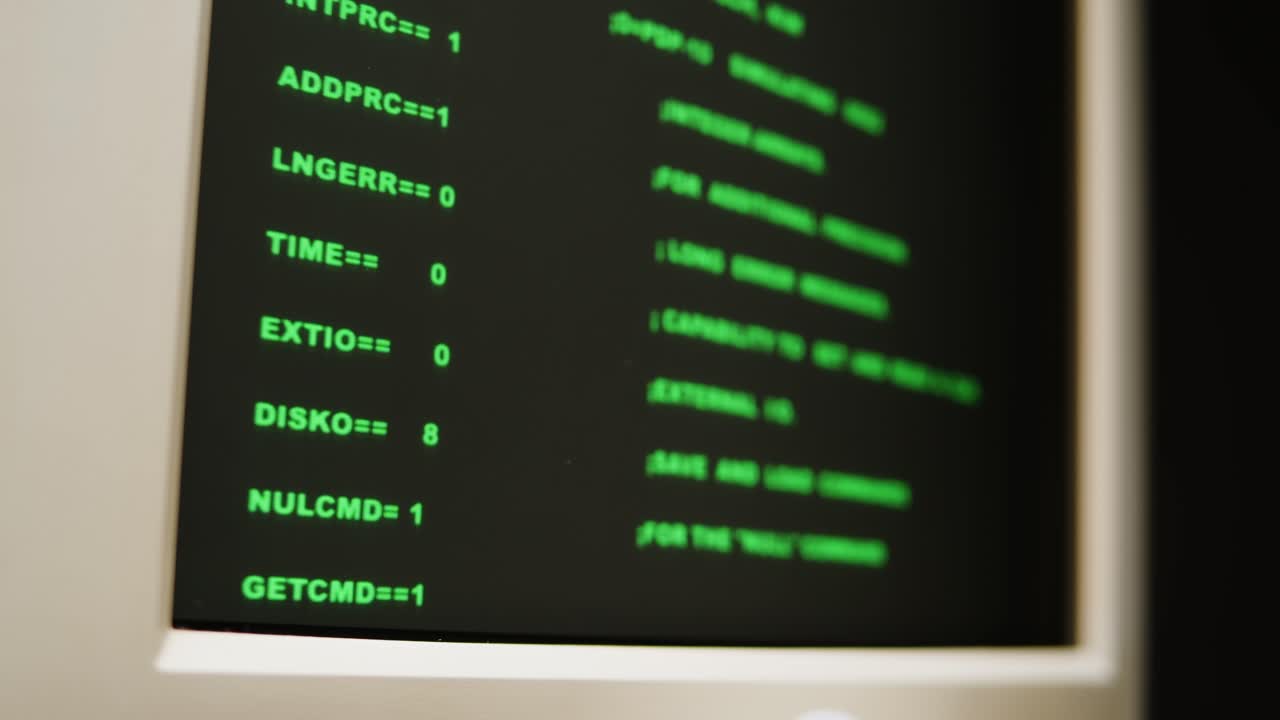 Vintage Computer Terminal Screen Displaying Code
