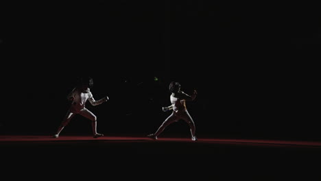 two fencers competing in a match