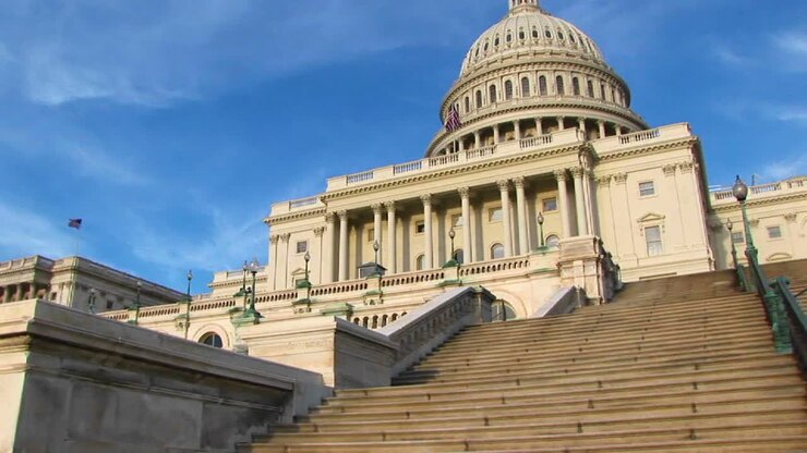 Looking Up The Steps Of The Us Capitol Building In Washington Dc To Its Landmark Dome