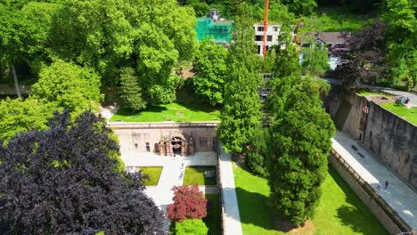 4k aerial drone video of gardens surrounding the historic castle on königstuhl hill overlooking heidelberg, germany
