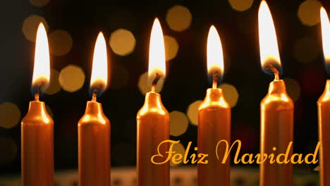animación de texto de feliz navidad sobre velas
