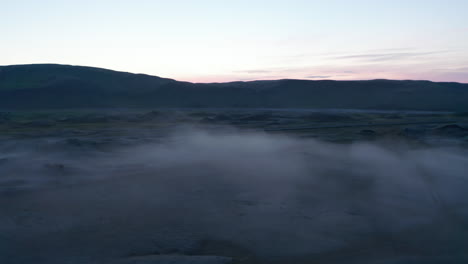 Foggy-misty-aerial-view-of-dramatic-countryside-in-Iceland.-Scenery-moody-autumnal-view-of-icelandic-highlands.-Amazing-on-earth