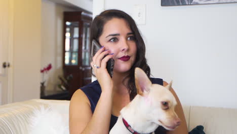 a woman using a phone with a dog