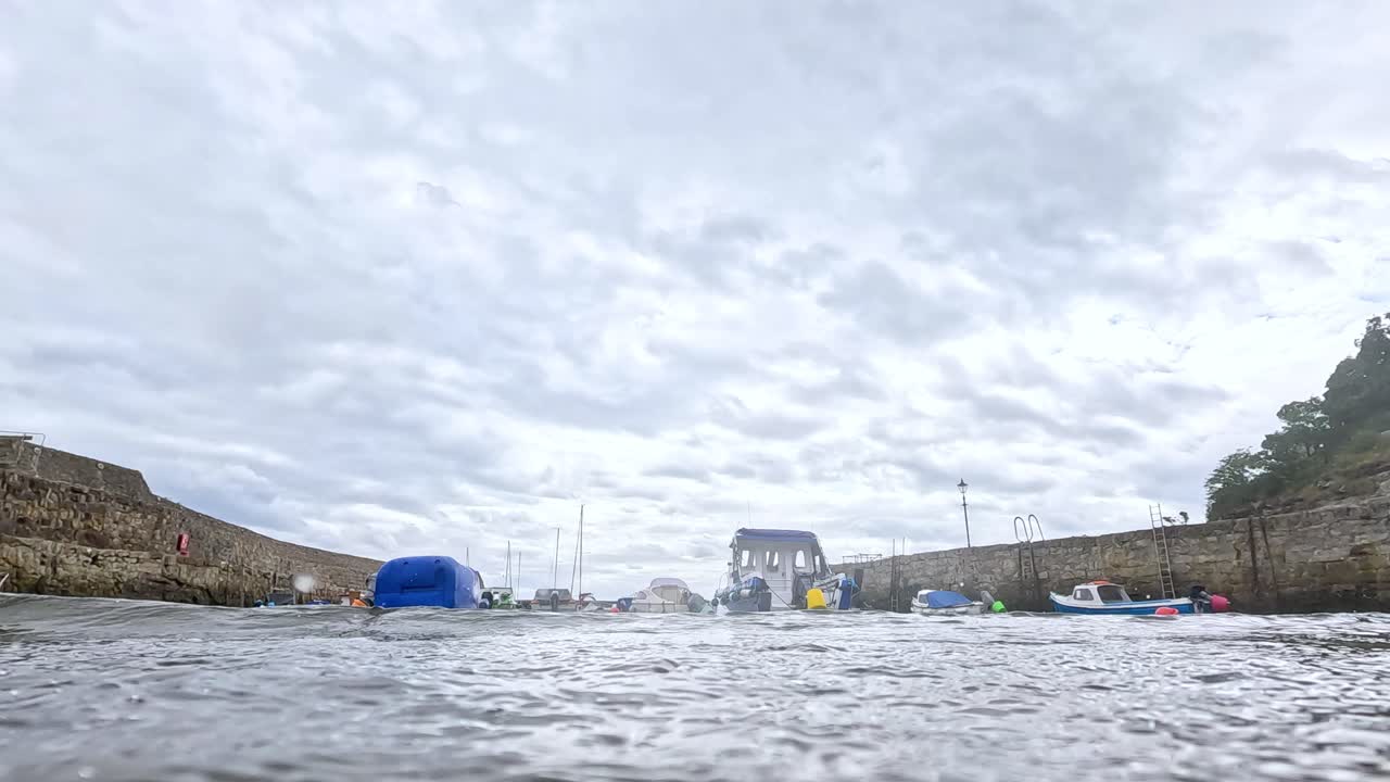 Waves splashing in a harbor in Fife