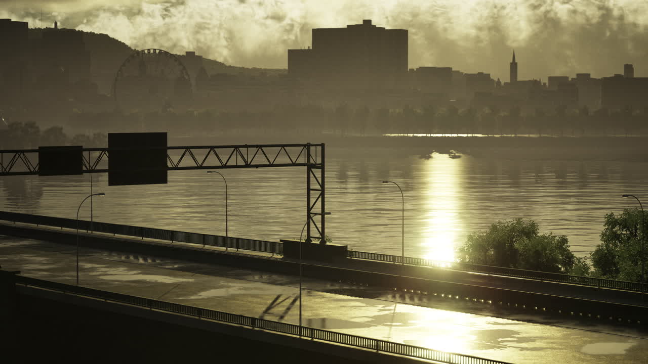 Sunset over river reflects city skyline and empty highway