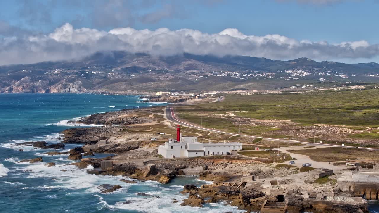 Coastline view of lighthouse and waves in Portugal from above