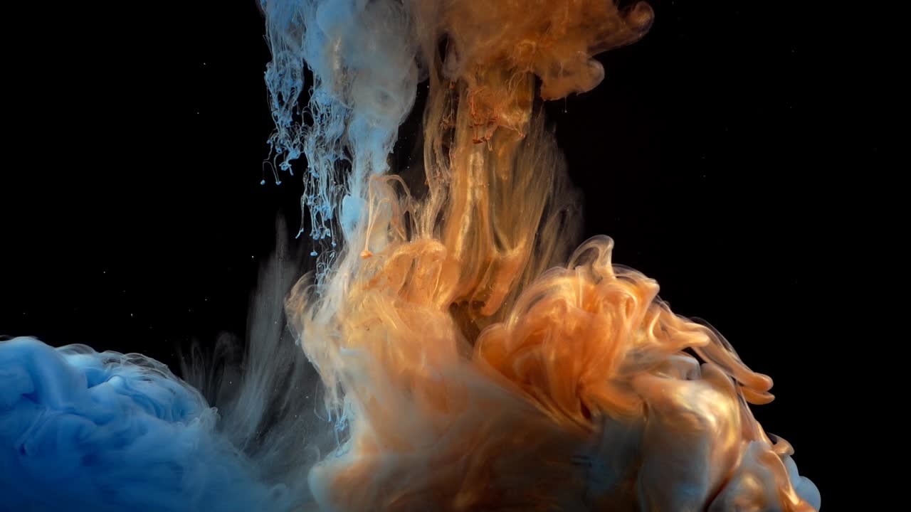Paints. Abstract forms. Shooting on a black background