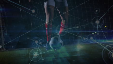 Animation-of-network-of-connections-over-low-section-of-male-soccer-player-playing-soccer