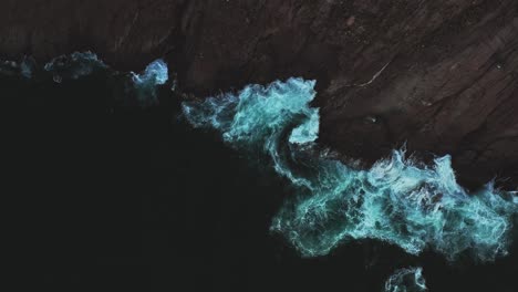 scenic view of the black sea, crashing against a rocky cliff