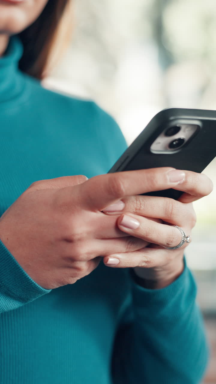 Close Up of Woman's Hands Scrolling and Typing on a Smartphone
