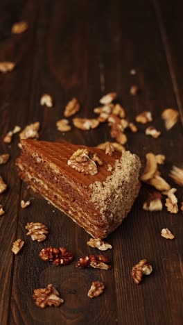 slice of caramel walnut cake on wooden table