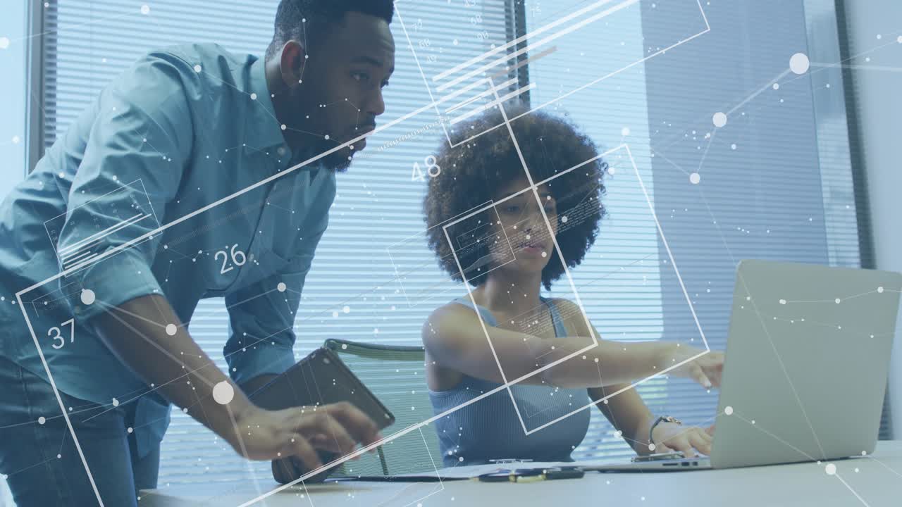 Man carrying tablet showing data and guiding woman typing on laptop with technology overlay