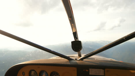 Aircraft-flying-over-the-mountain-4k