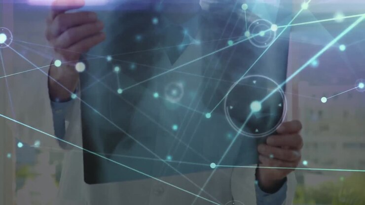 Animation of network of connections over hands of caucasian male doctor with x ray photo