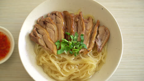 dried noodles with stewed duck in white bowl - asian food style