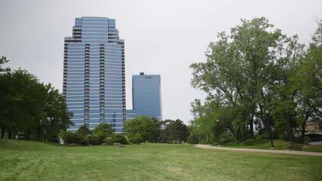 tall buildings next to a park in downtown grand rapids, michigan