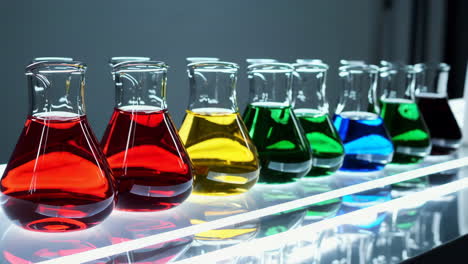 colorful liquids in flasks in a lab