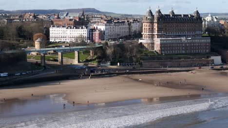 Aerial-footage-of-Scarborough-Spa-bridge,-The-Grand-Hotel-in-winter